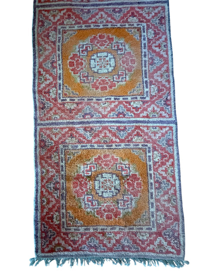 An antique triple seater Tibetan meditation rug