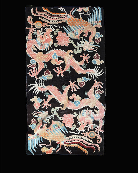 A mid 20th C., Tibetan dragon and phoenix rug