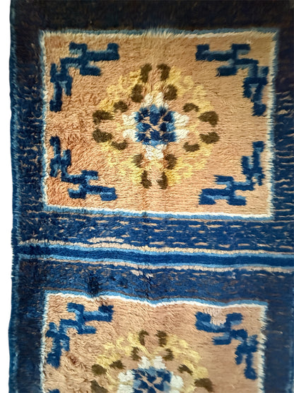 An antique triple seater Tibetan meditation rug