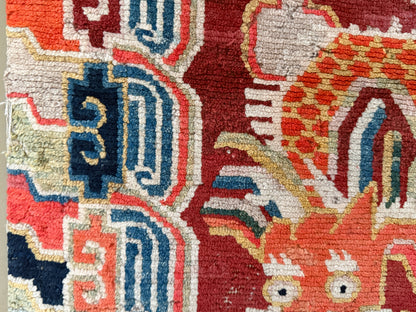 An early 20th C., antique Tibetan dragon rug