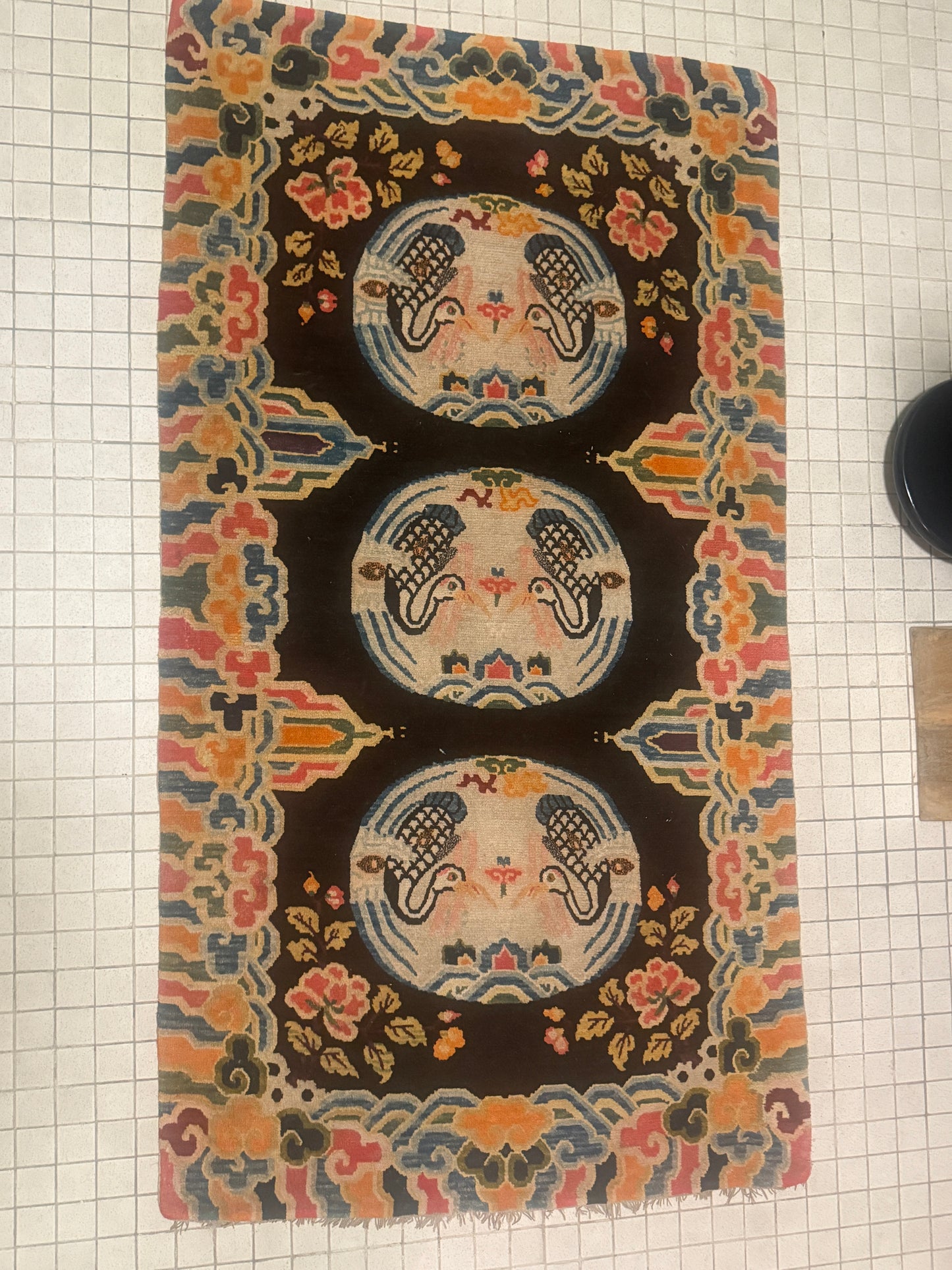 An antique early 20th c., Tibetan rug