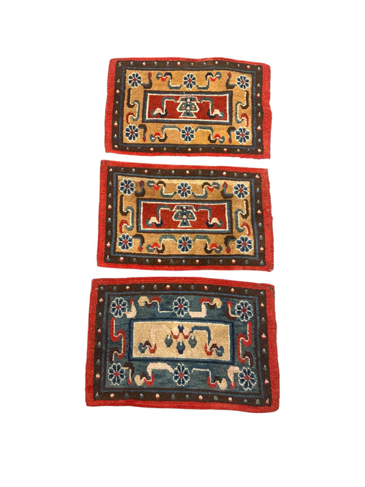 A set of three small place mat