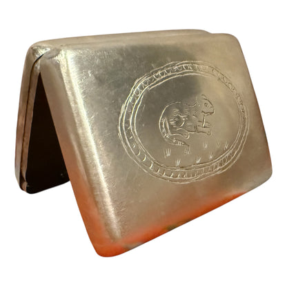 A silver box with hinged lid