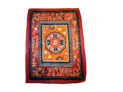 An antique meditation rug / saddle rug topper