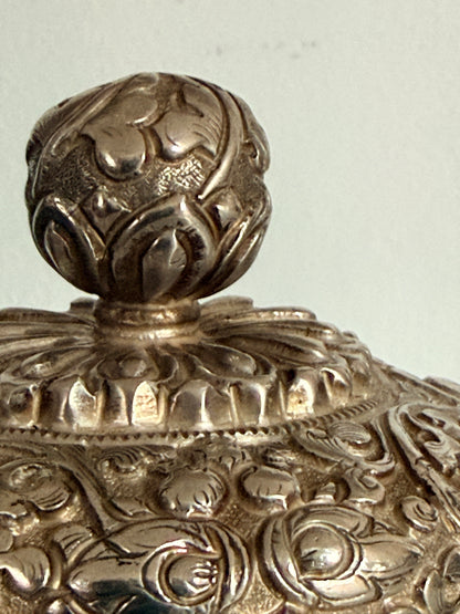An antique silver and gilt ceremonial Tibetan teapot