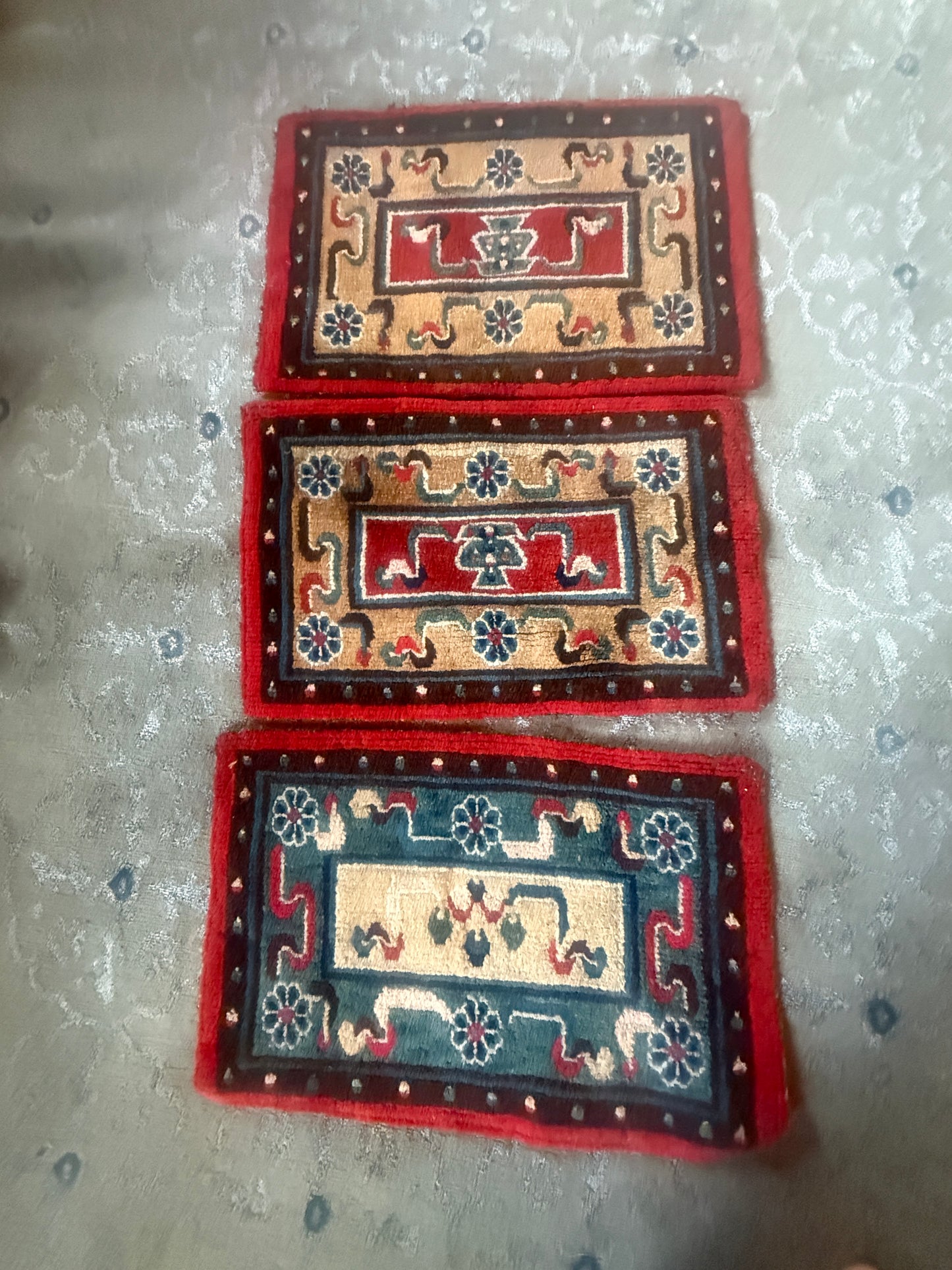 A set of three small place mat