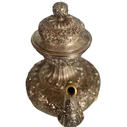 An antique silver and gilt ceremonial Tibetan teapot