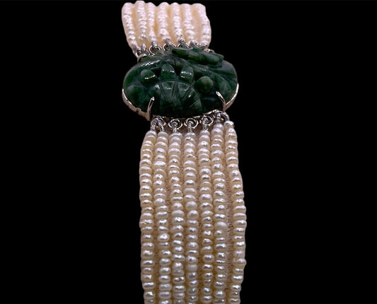 an antique seed pearl and jade plaque bracelet