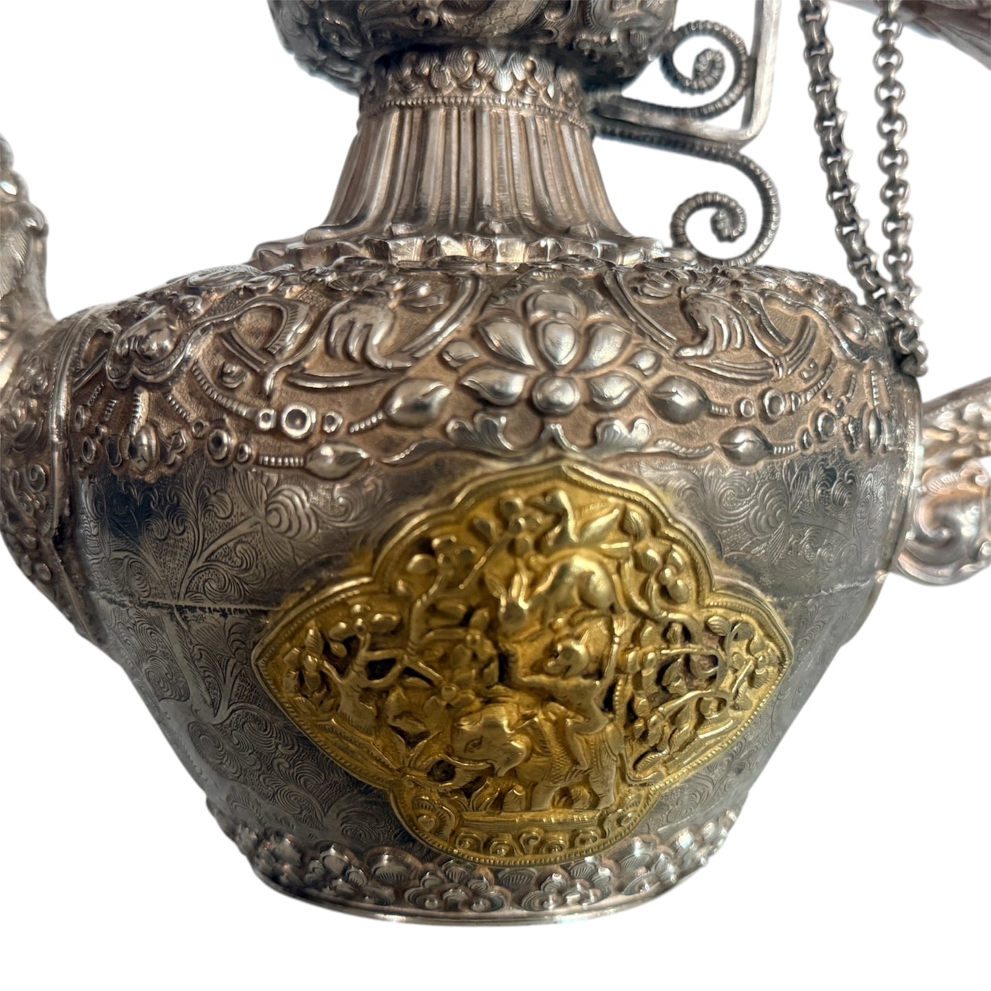 An antique silver and gilt ceremonial Tibetan teapot