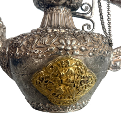 An antique silver and gilt ceremonial Tibetan teapot