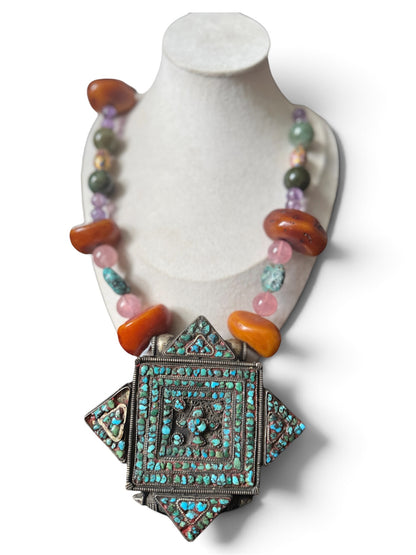 A vintage Tibetan ghau necklace