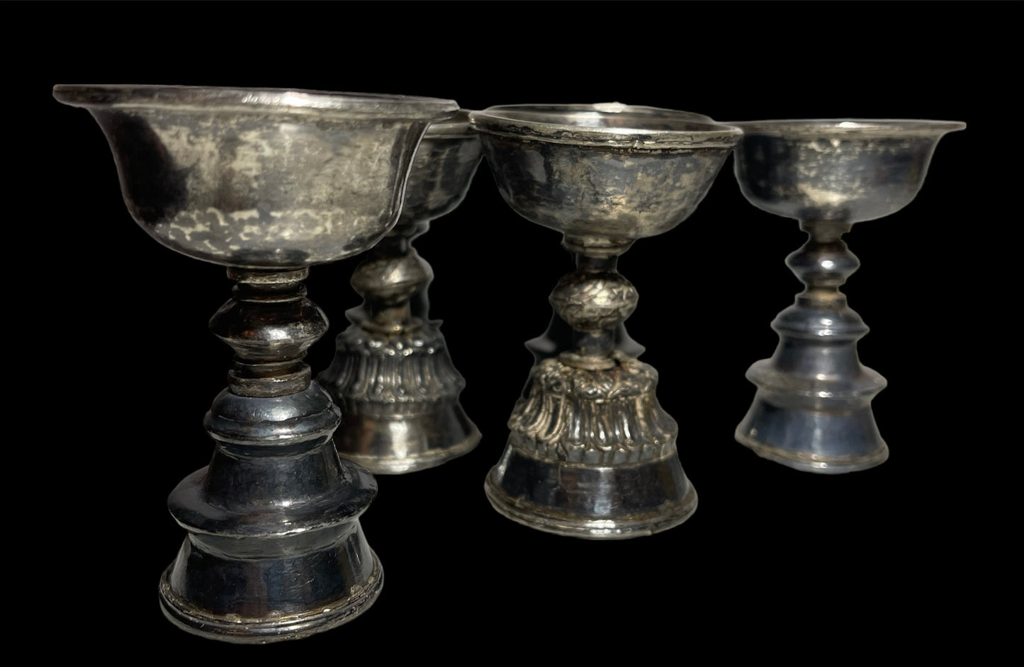 A set of 6 antique Tibetan silver butter lamps