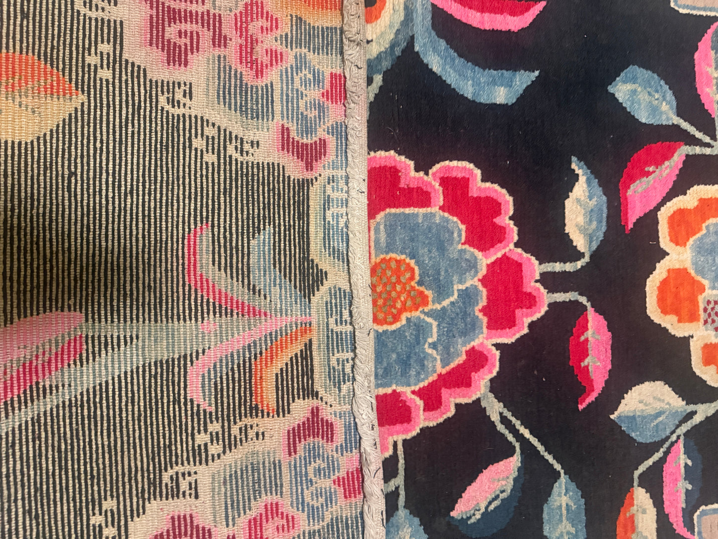 An early 20th C., antique black Tibetan with floral motif rug
