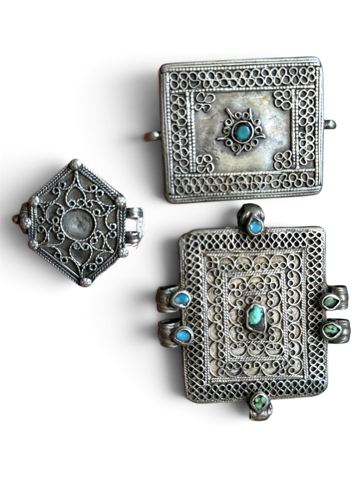 A set of three antique silver amulet boxes