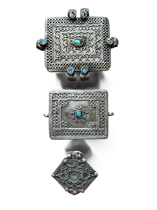 A set of three antique silver amulet boxes