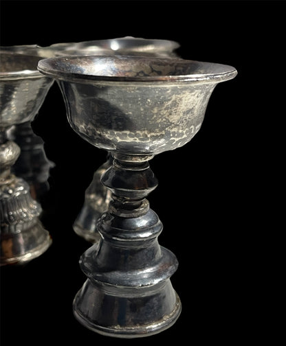 A set of 6 antique Tibetan silver butter lamps