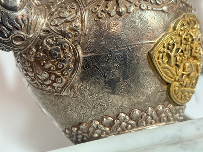 An antique silver and gilt ceremonial Tibetan teapot
