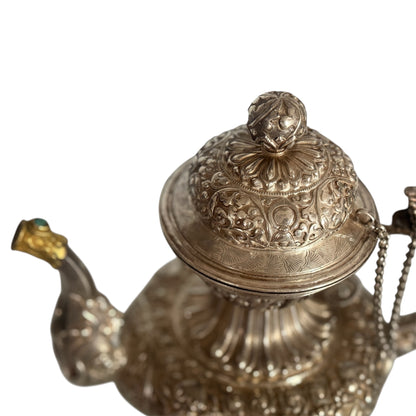 An antique silver and gilt ceremonial Tibetan teapot