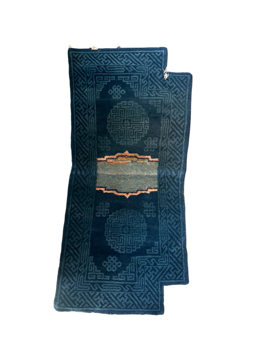 A vintage indigo Tibetan saddle rug