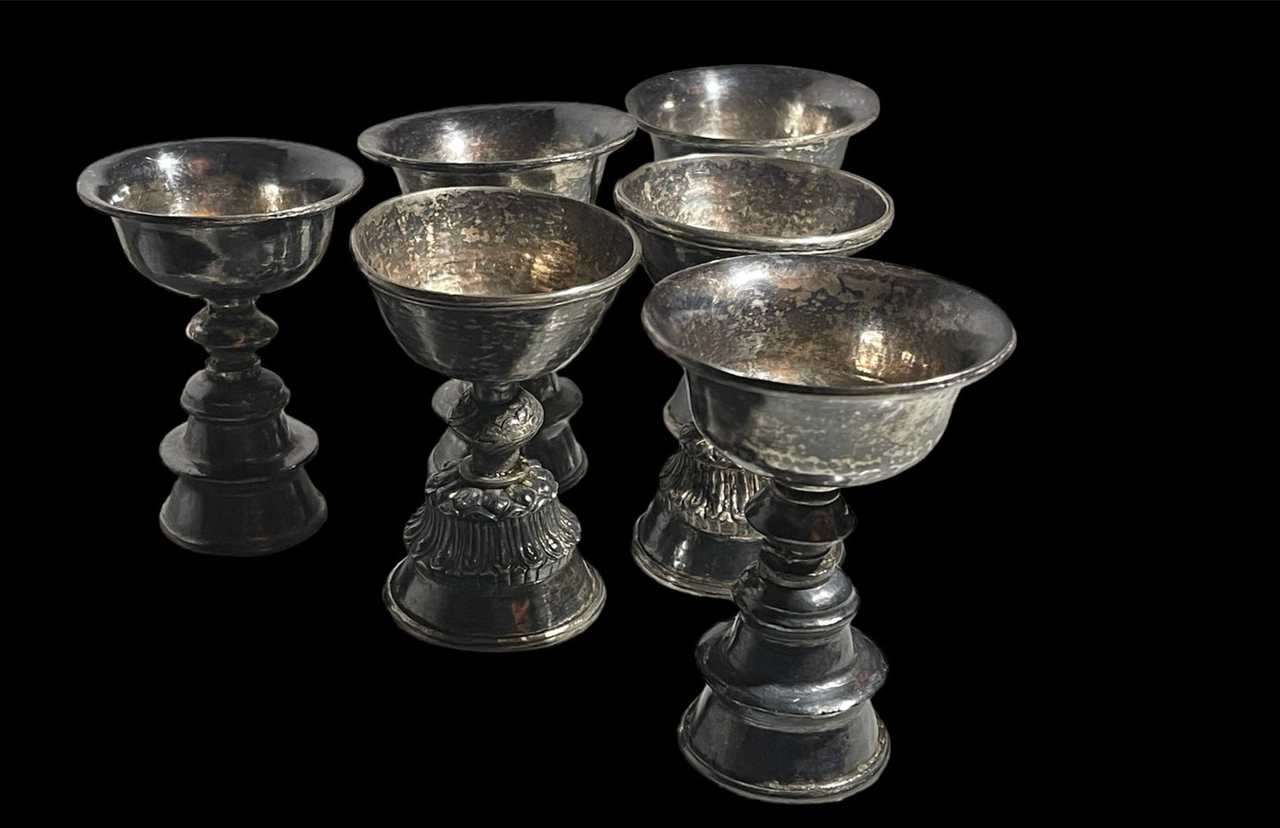 A set of 6 antique Tibetan silver butter lamps