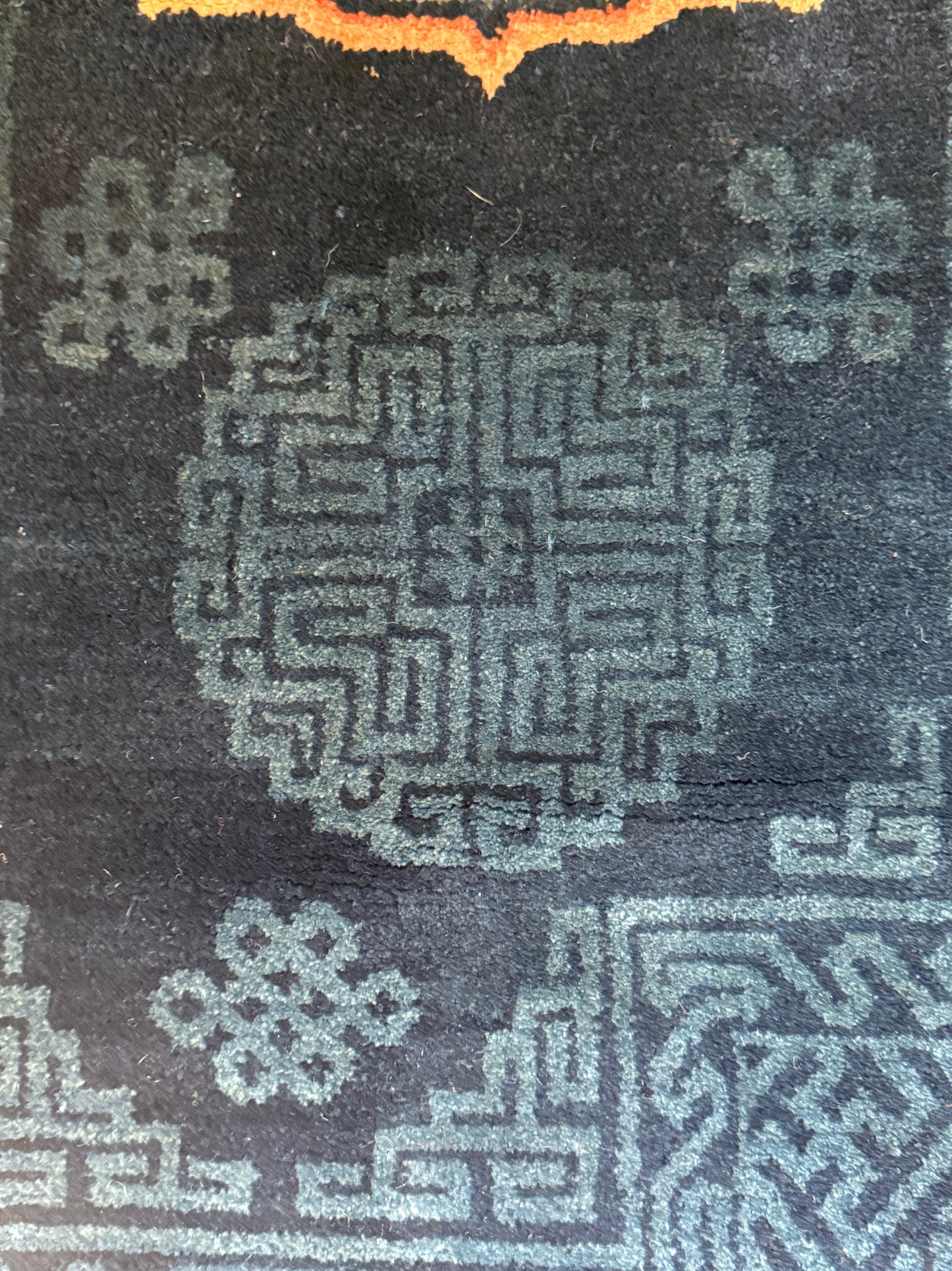 A vintage indigo Tibetan saddle rug
