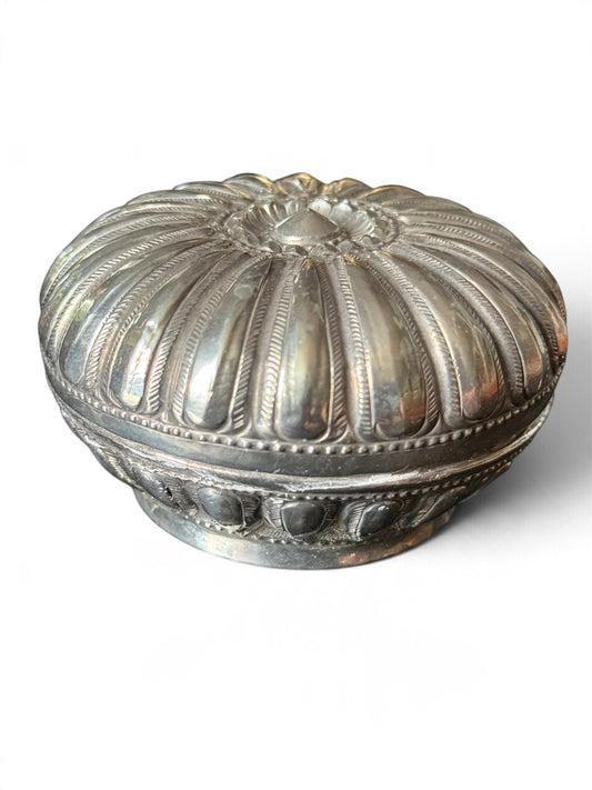 An antique silver south East Asian round box with lid