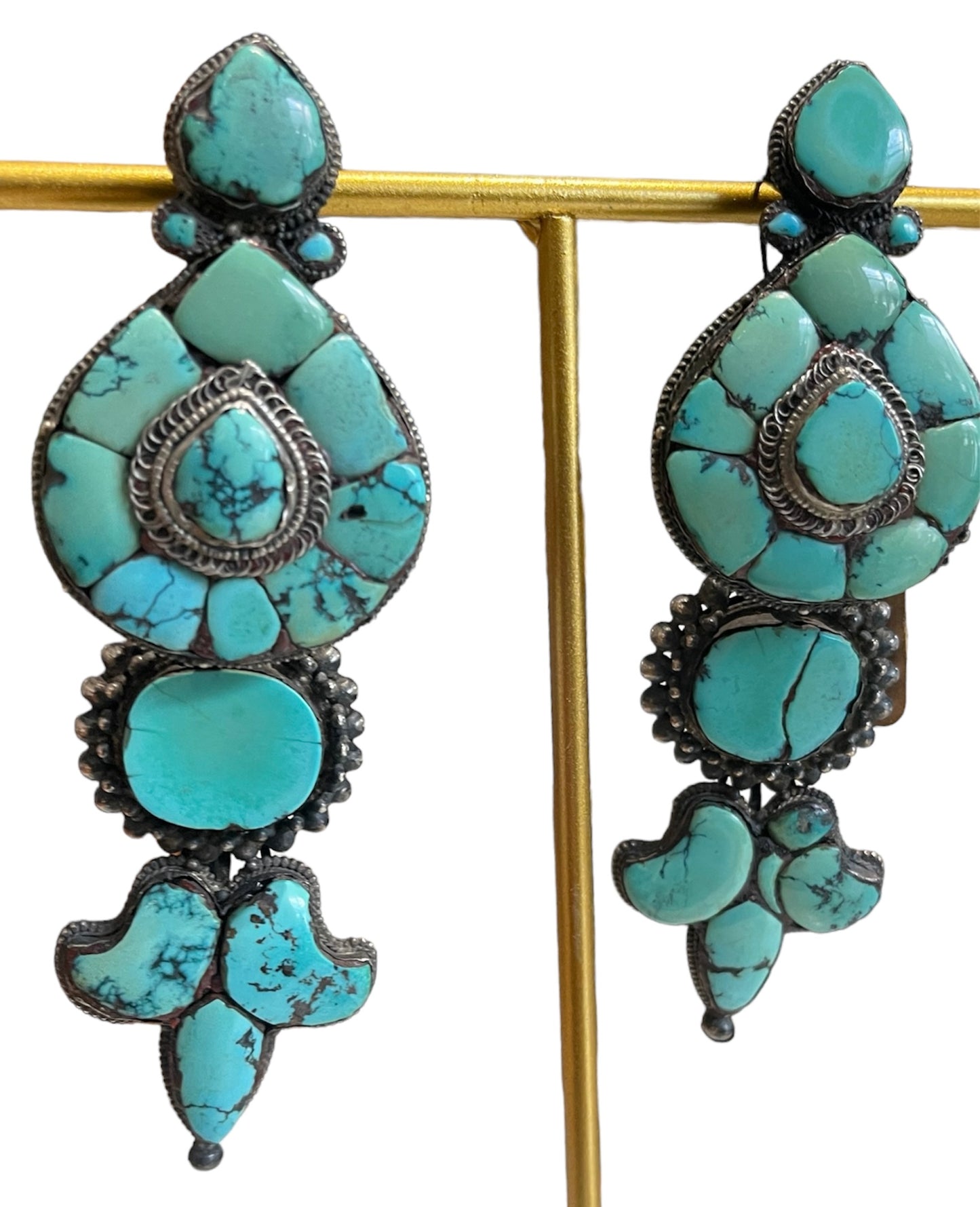 A pair of antique Tibetan turquoise and silver ear pendants