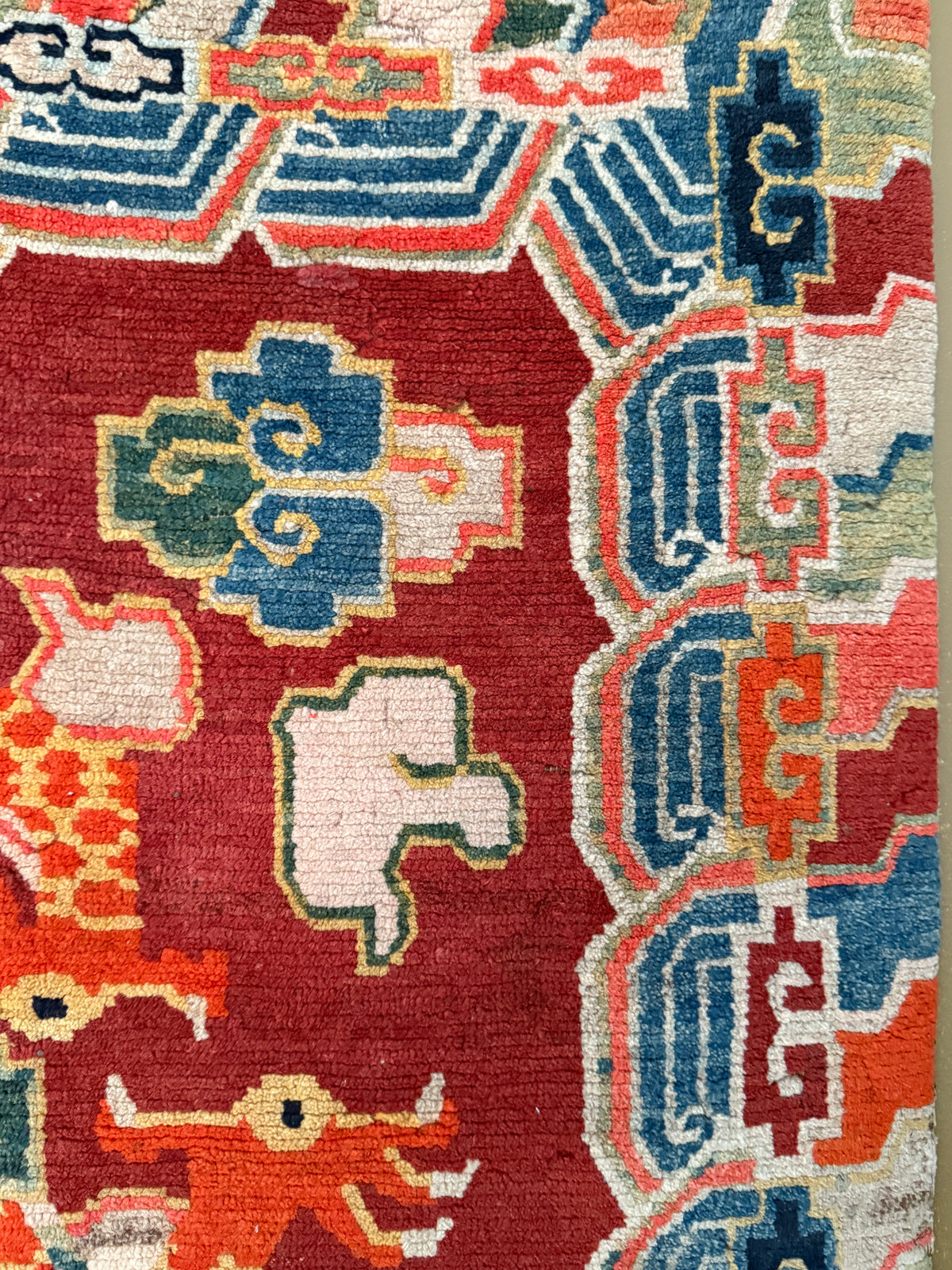 An early 20th C., antique Tibetan dragon rug