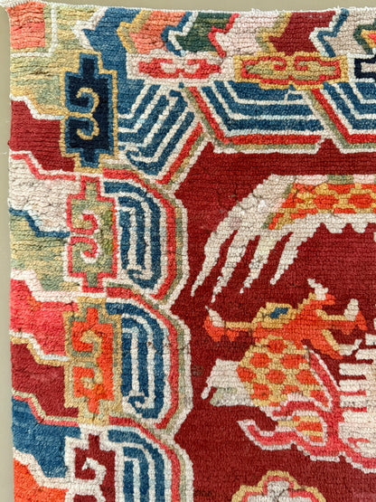 An early 20th C., antique Tibetan dragon rug