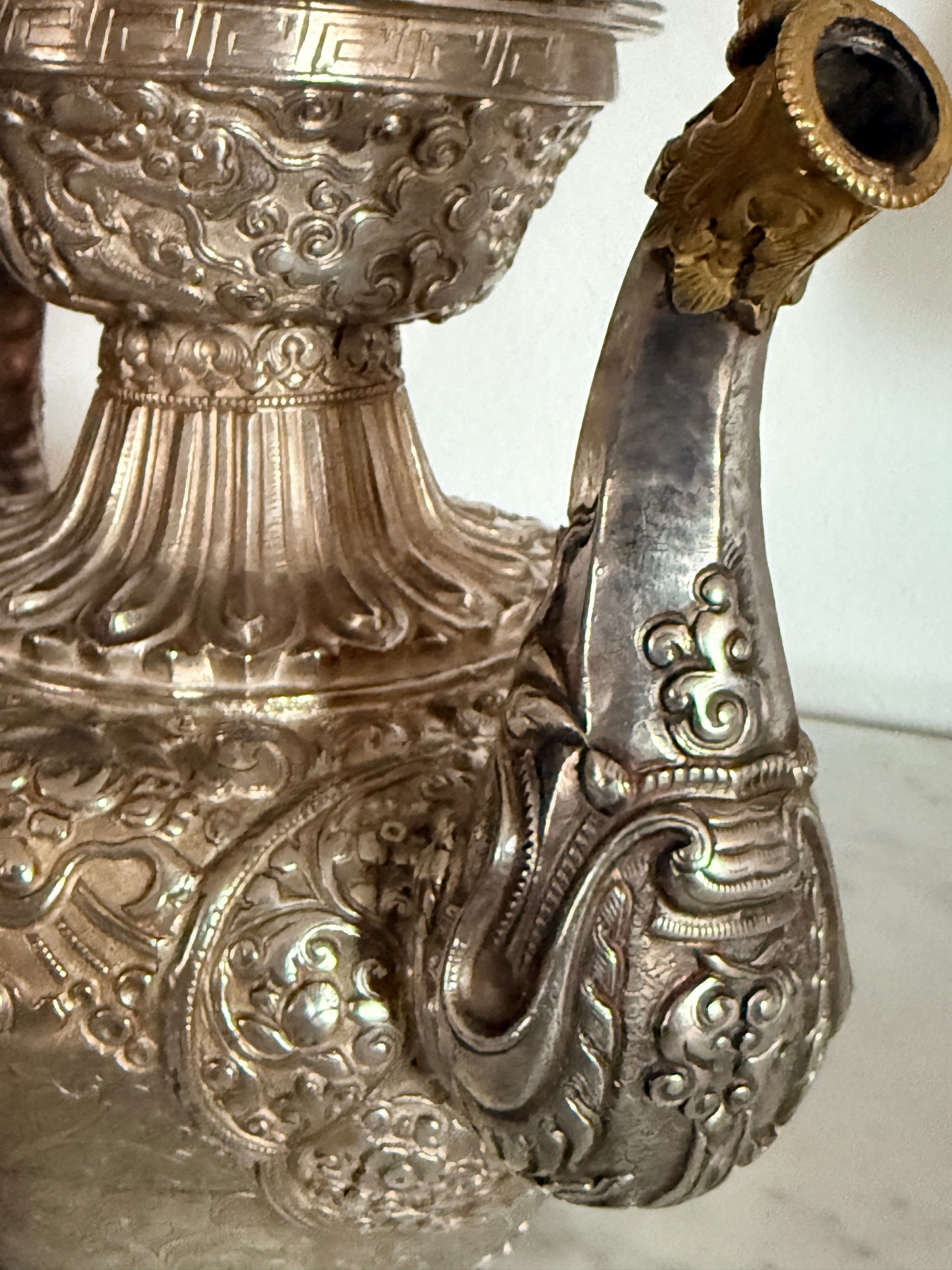An antique silver and gilt ceremonial Tibetan teapot