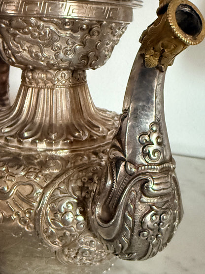 An antique silver and gilt ceremonial Tibetan teapot