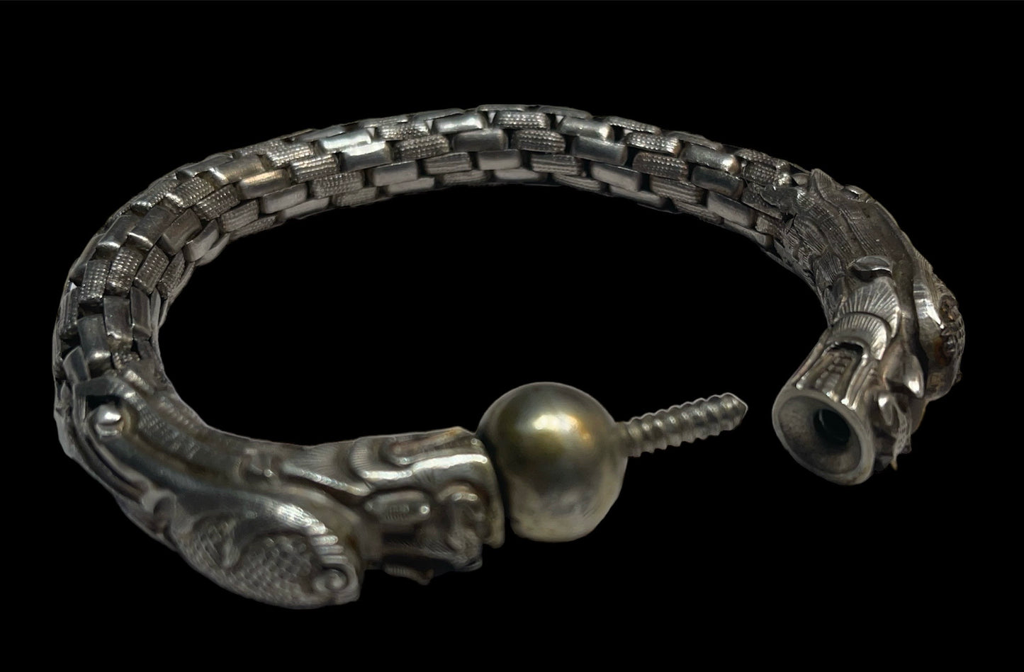 An antique double dragon with pearl silver link bracelet