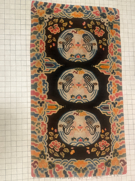 An antique early 20th c., Tibetan rug