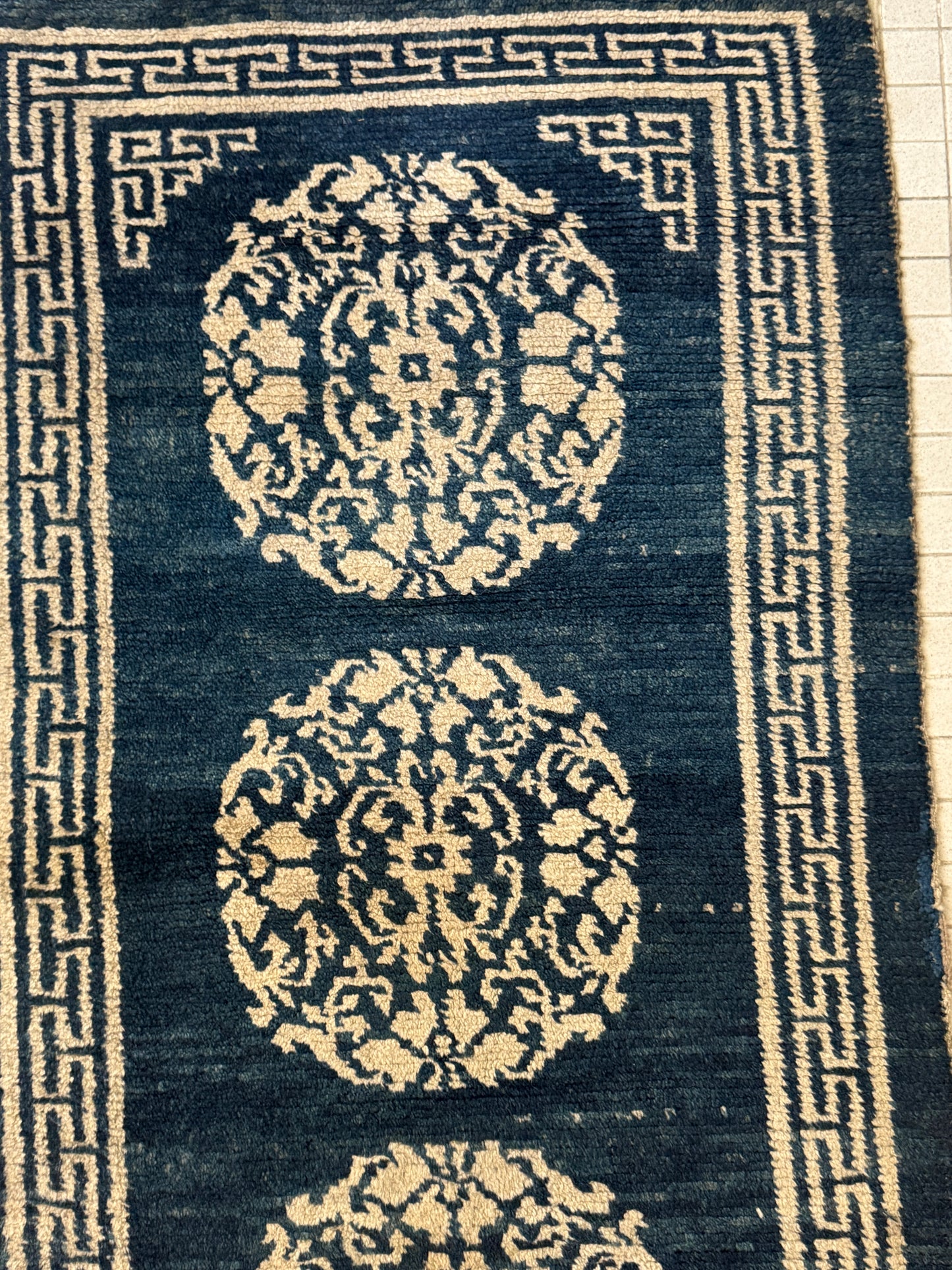 An antique Tibetan residential  rug with medallions
