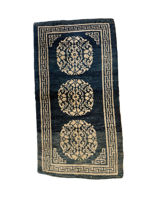 An antique Tibetan residential  rug with medallions