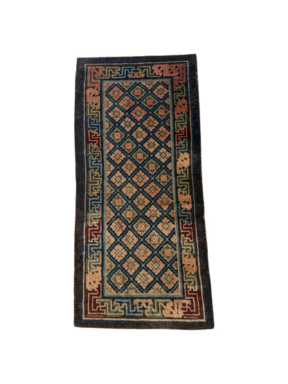 Antique rug with floral motifs arranged in a geometrical design