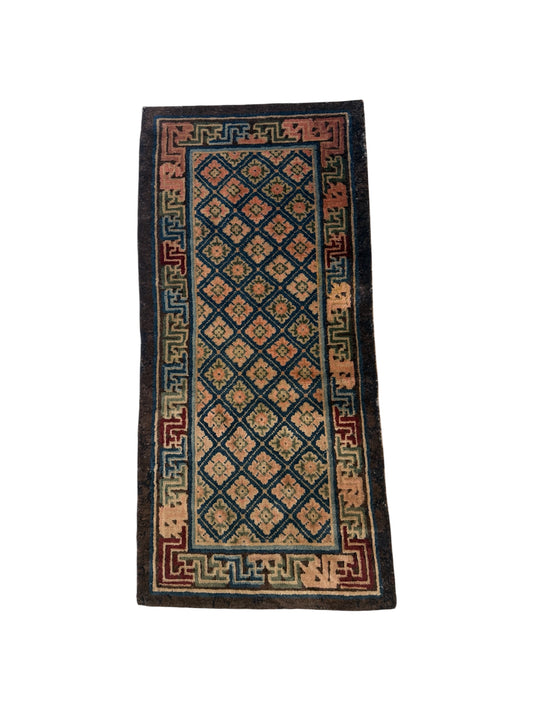 Antique rug with floral motifs arranged in a geometrical design