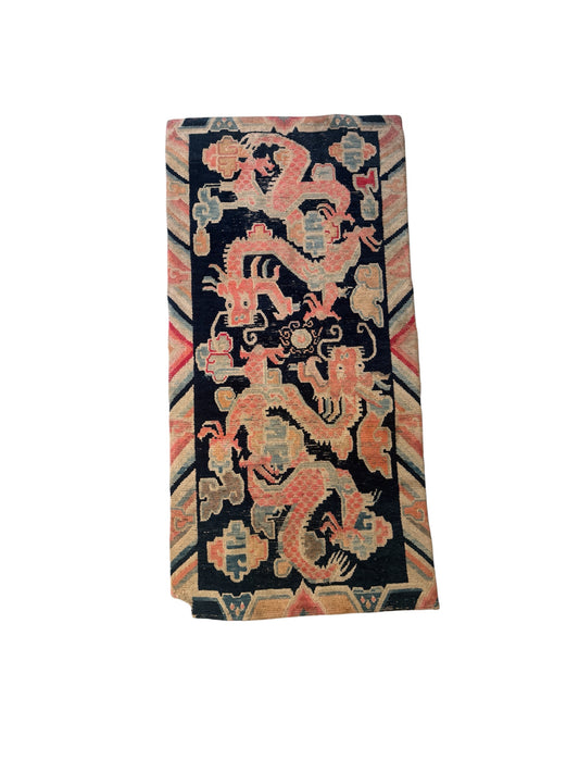 A 19th C., antique Tibetan dragon rug