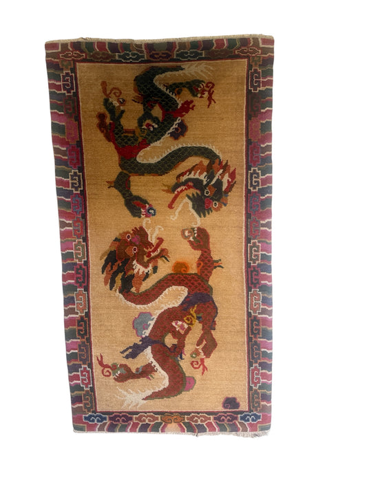 A vintage mid 20th c. Tibetan rug with dragons