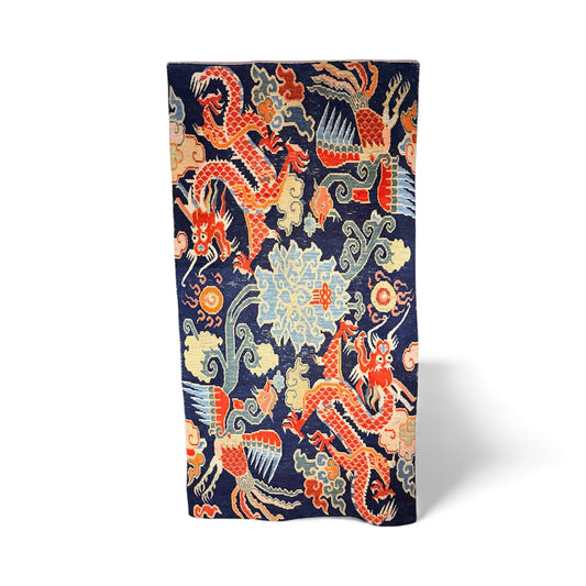 A mid 20th C., Tibetan dragon and phoenix rug