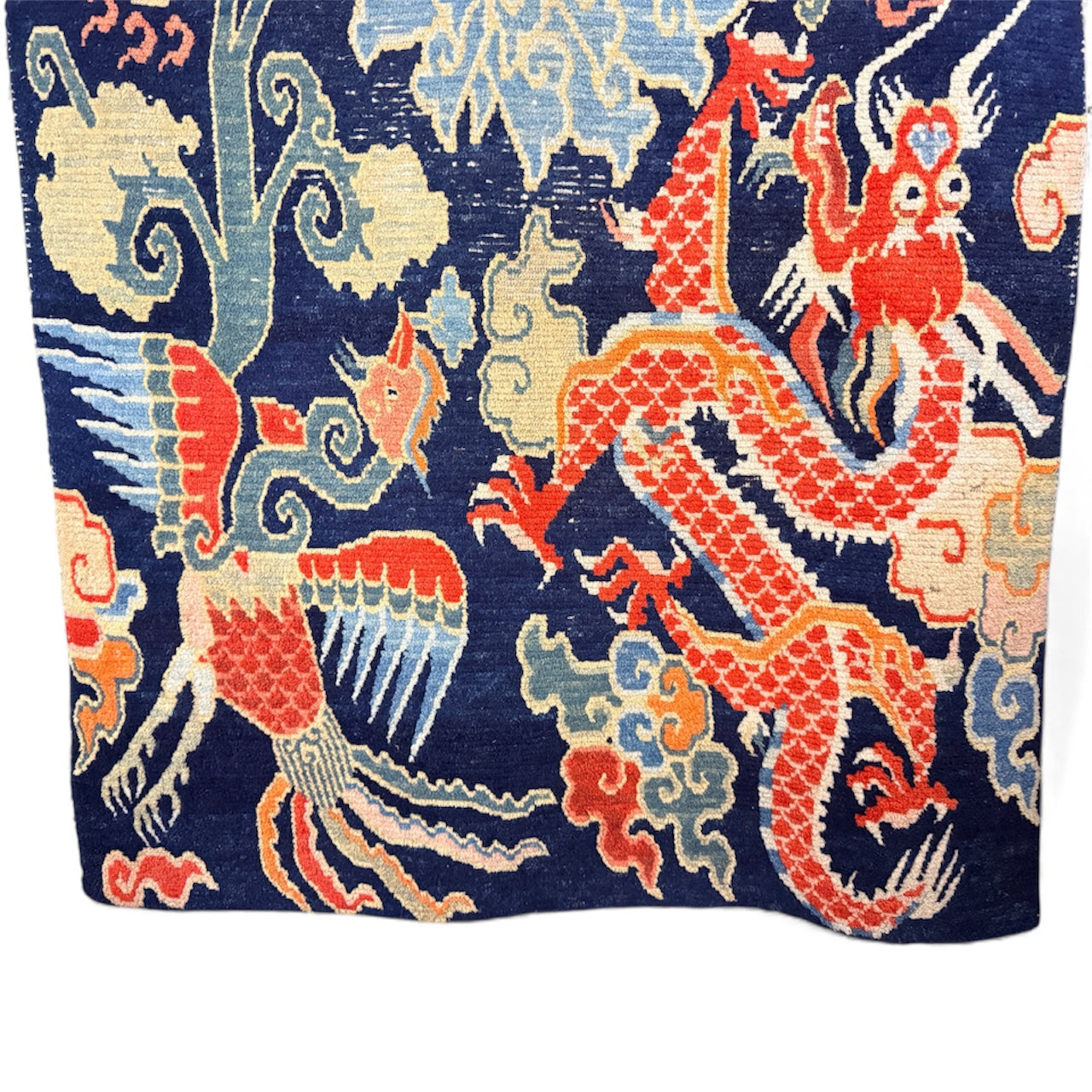 A mid 20th C., Tibetan dragon and phoenix rug
