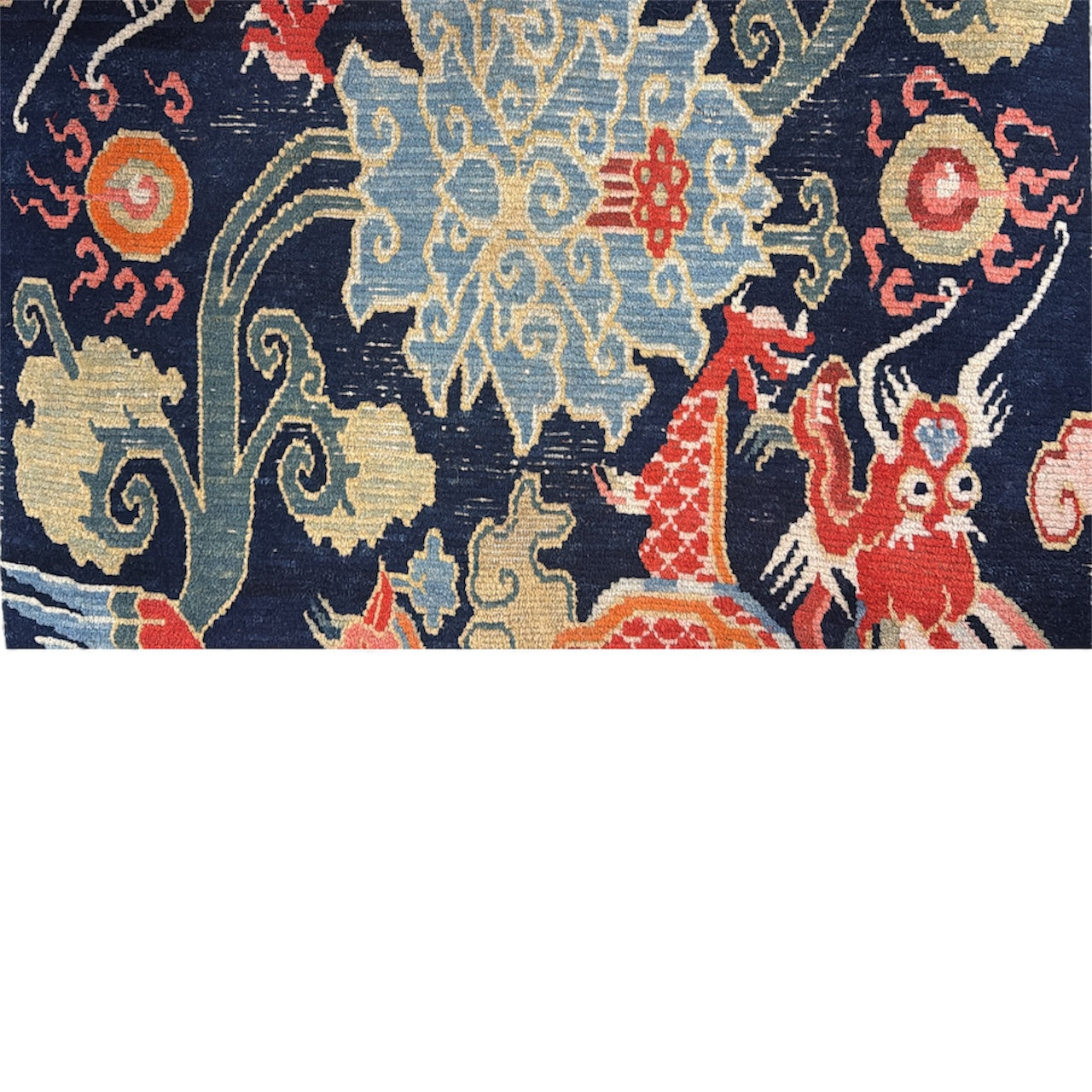A mid 20th C., Tibetan dragon and phoenix rug