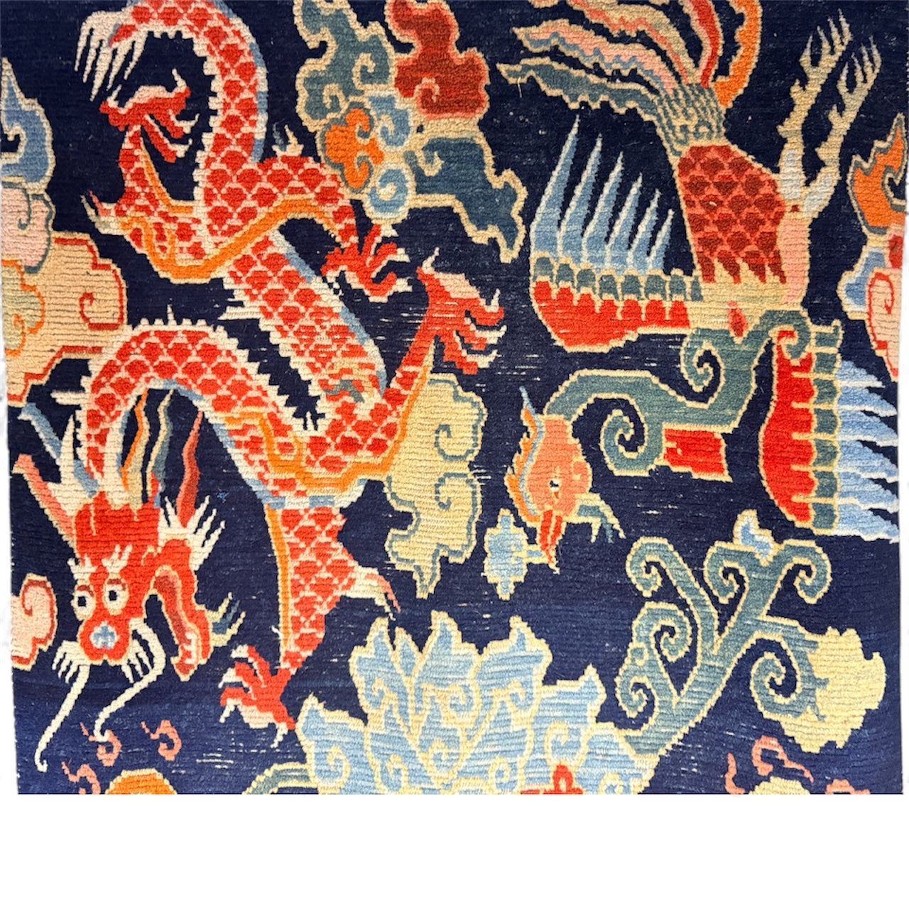 A mid 20th C., Tibetan dragon and phoenix rug