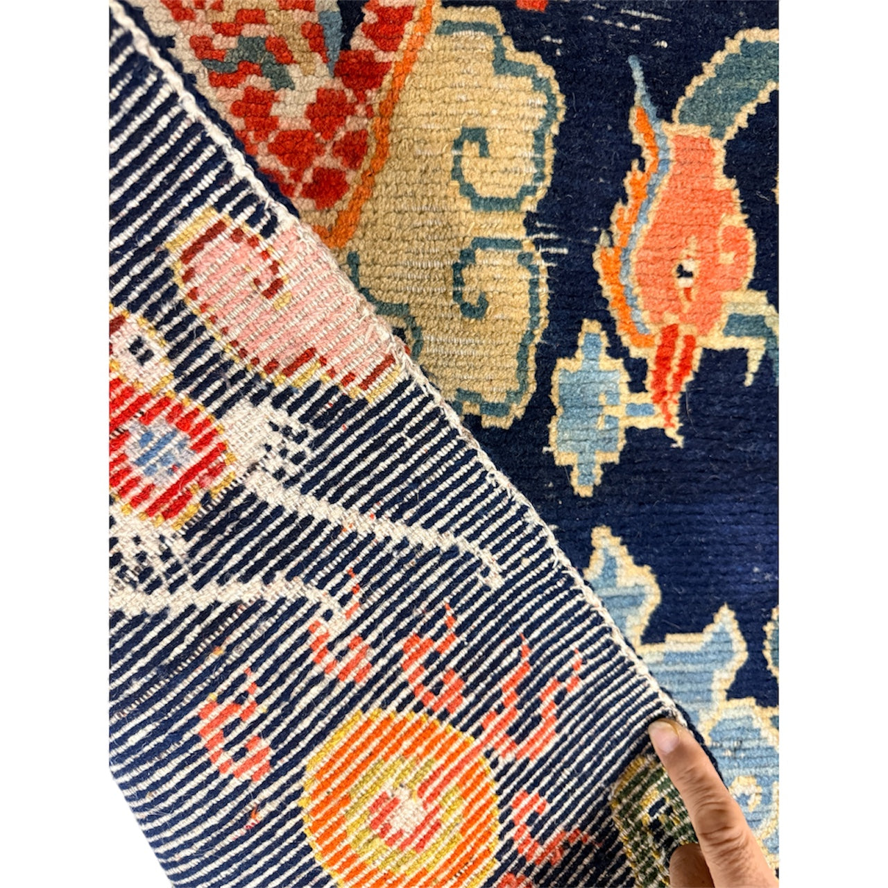 A mid 20th C., Tibetan dragon and phoenix rug