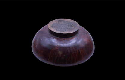 An antique burlwood tsampa container with lid