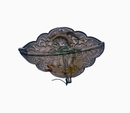 An antique Tibetan silver belt buckle