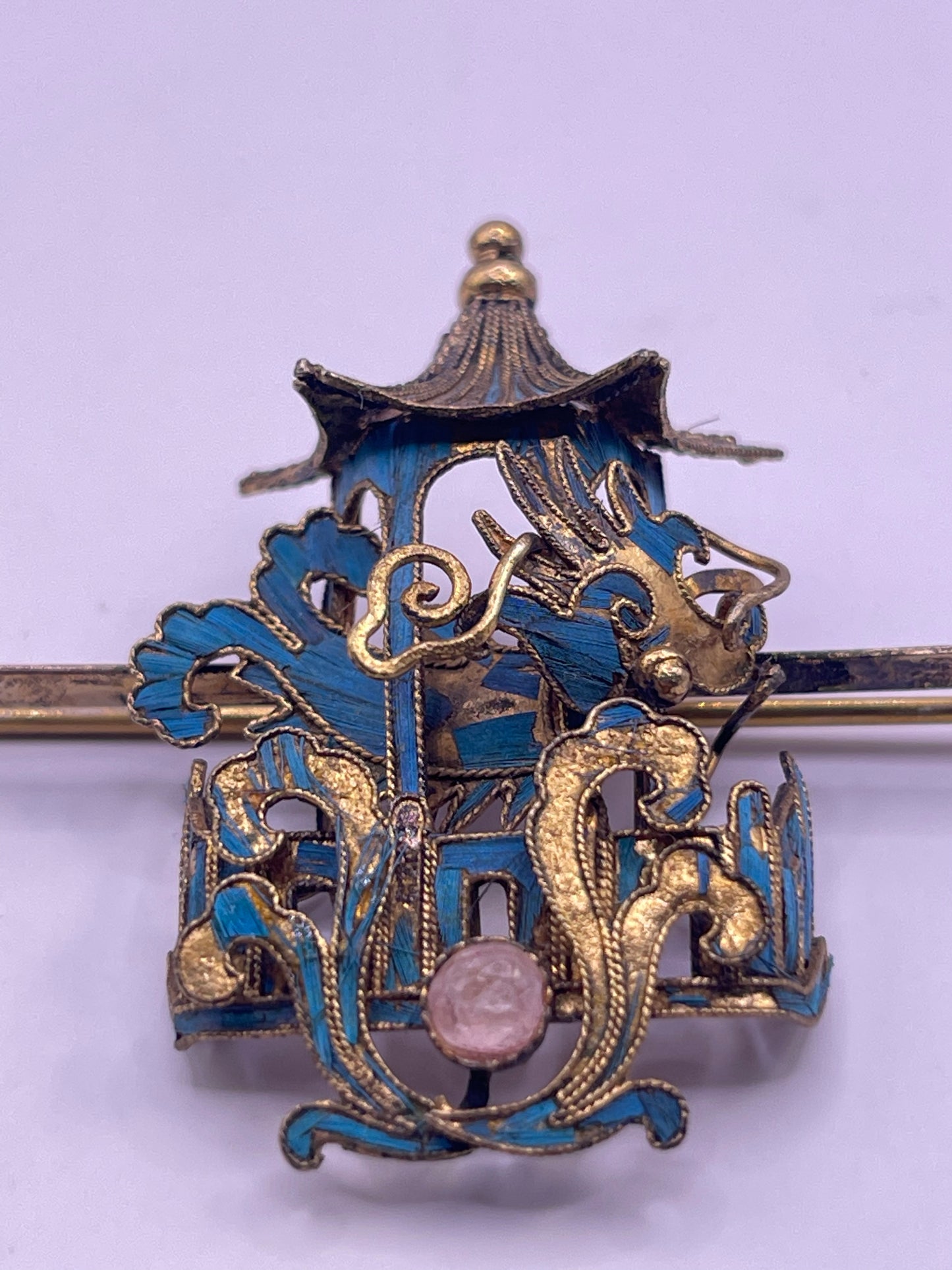 A dragon and pagoda kingfisher pin