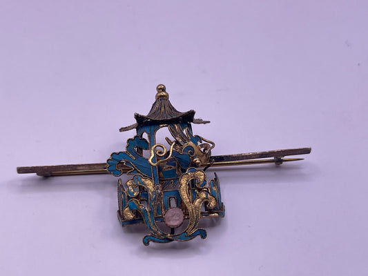 A dragon and pagoda kingfisher pin