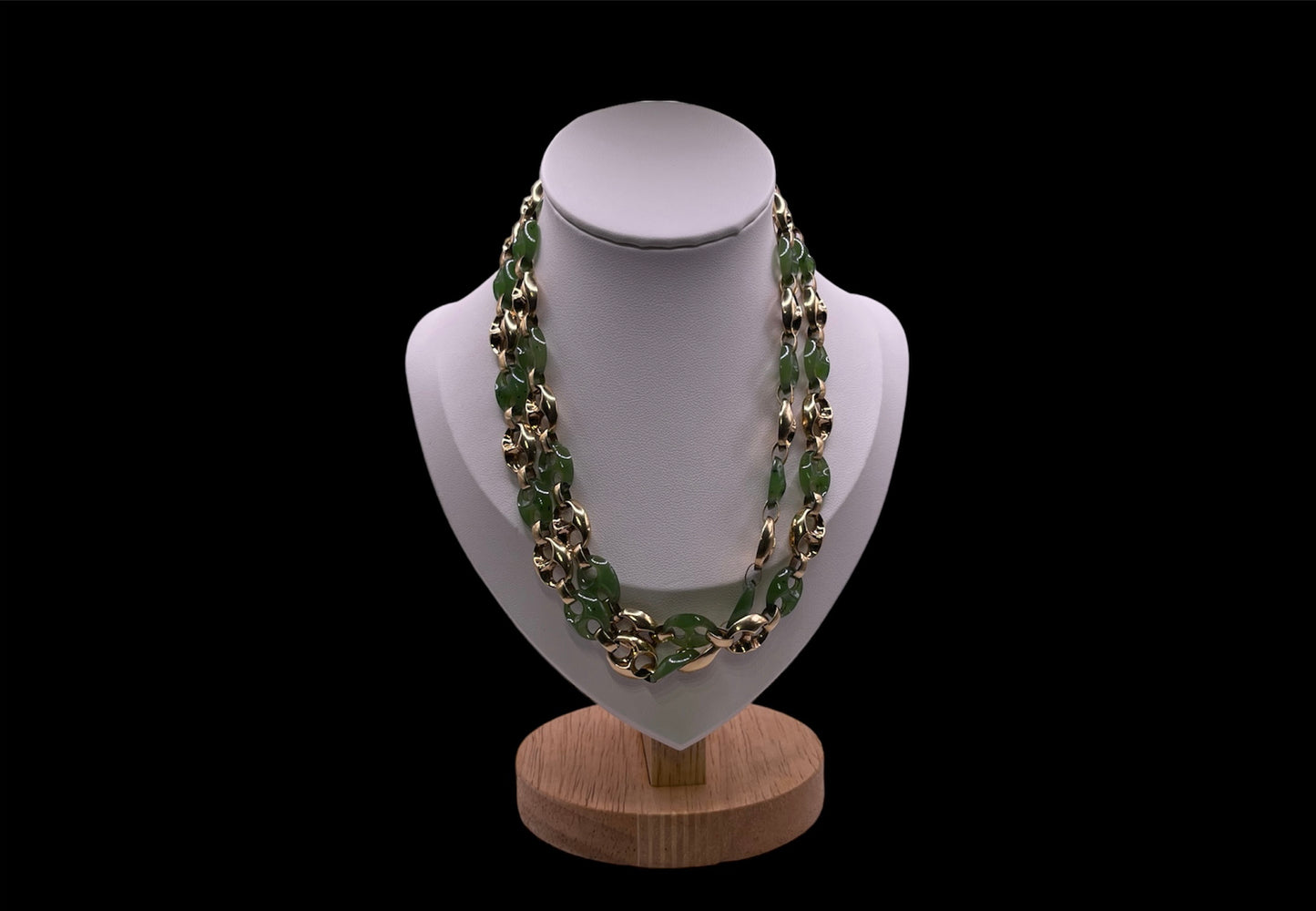 A carved nephrite jade and 14kt gold necklace