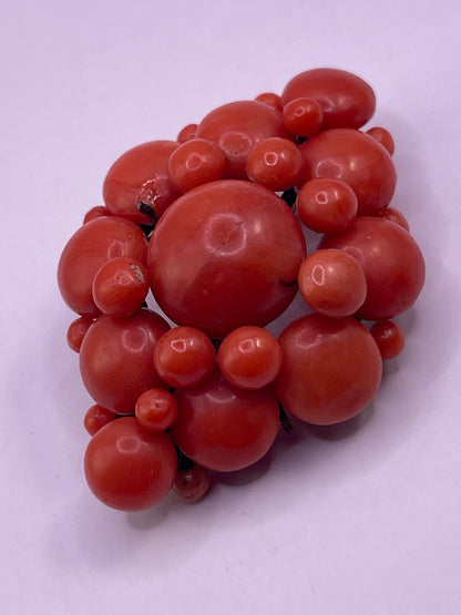 A natural untreated coral orange/ pink pin/ pendant